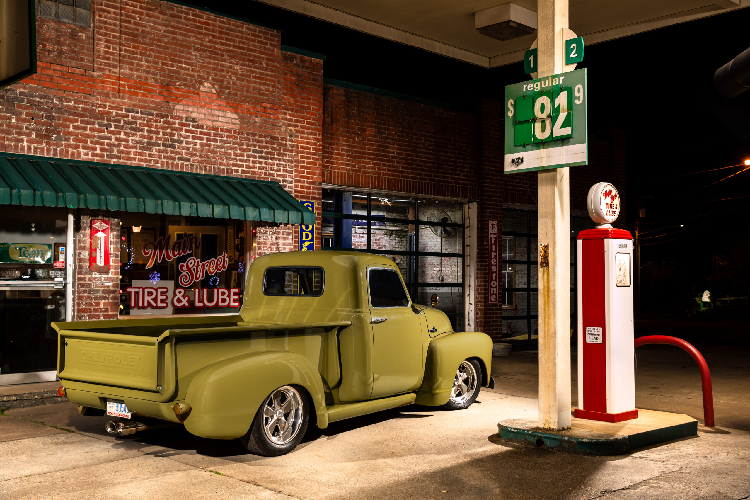 02 1952 Chevrolet 3100 rear view showcasing a custom lowered stance and classic Chevrolet tailgate