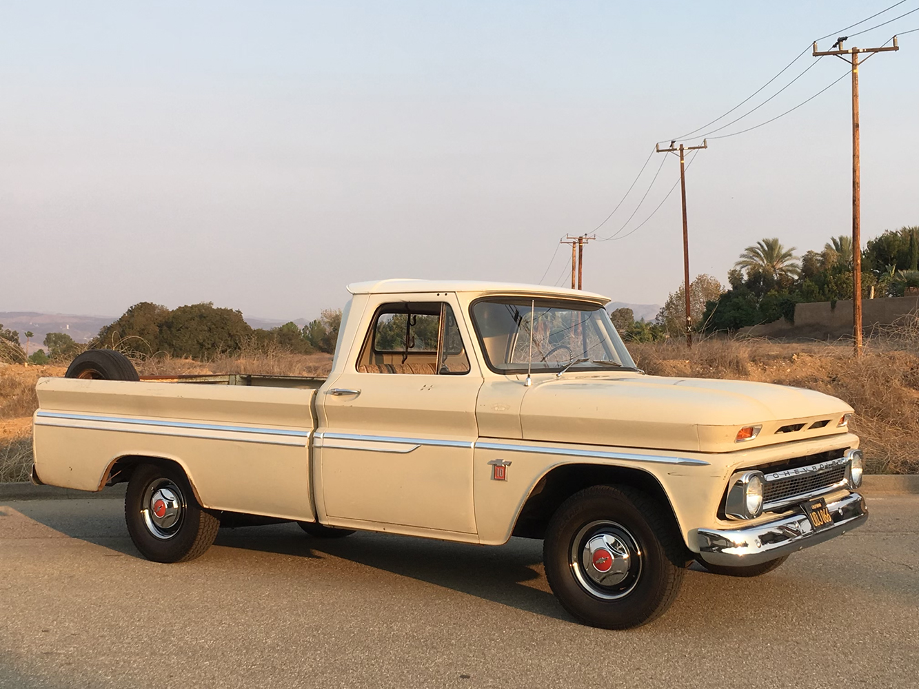 02 1964 Chevrolet C10 long bed in original patina with chrome trim and factory hubcaps