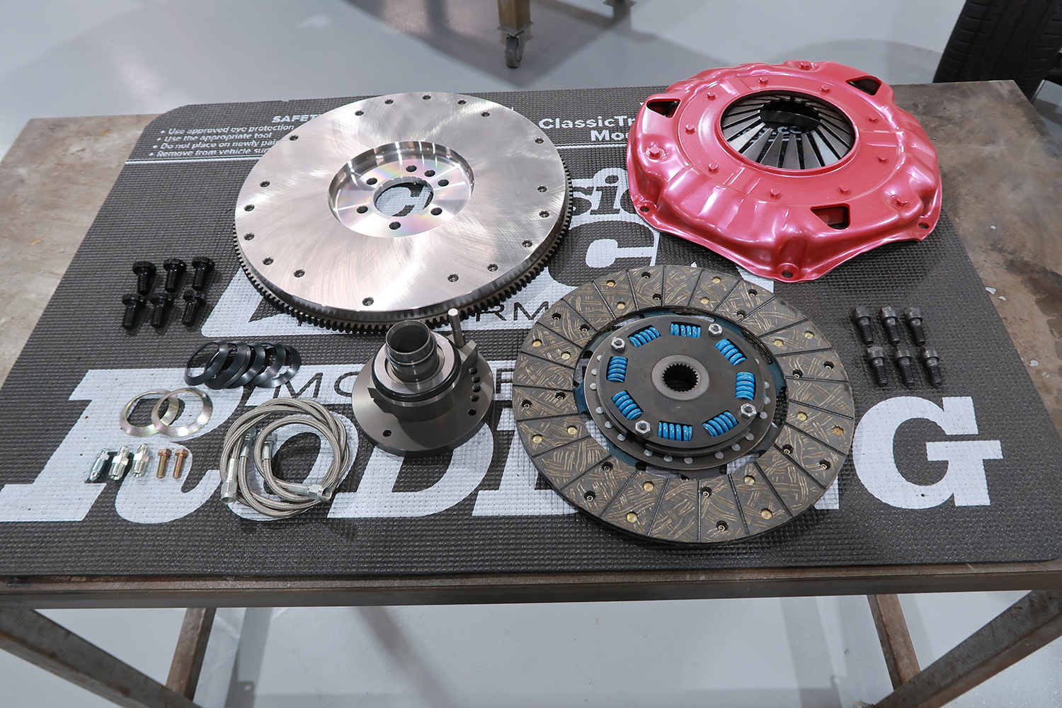 02 Clutch assembly laid out with flywheel pressure plate disc and hydraulic throwout bearing