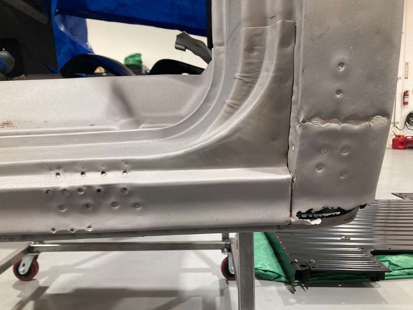 02 Inner rocker panel showing rust holes and previous spot weld locations