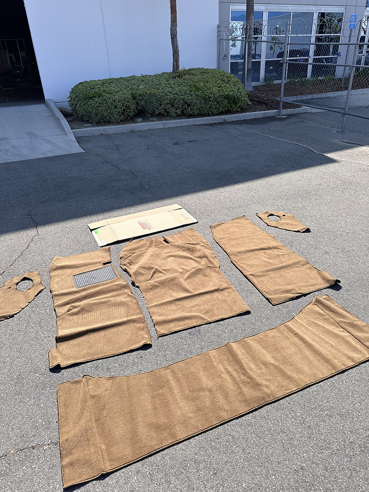 02 Laid out brown carpet pieces prepared for installation in C10 interior