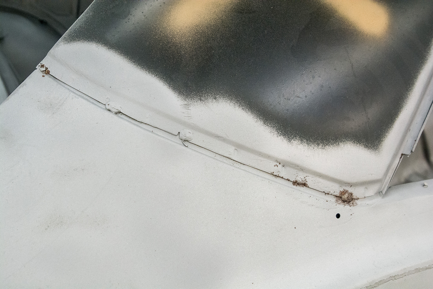 02 close up of rust and damage around the rear window area highlighting the need for panel replacement