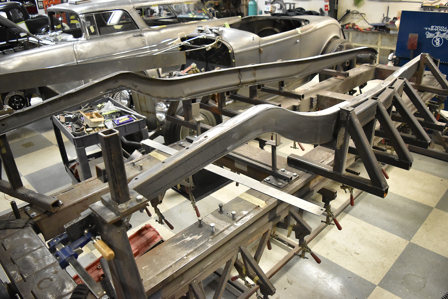 03 Raw steel 1932 Ford Roadster frame under construction on a jig table in a custom fabrication shop
