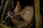 05 1952 Chevrolet 3100 interior with custom brown leather bucket seats and stitched detailing
