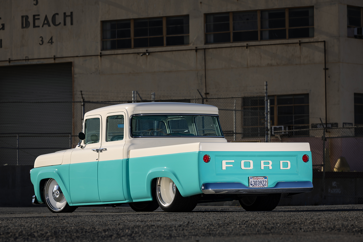 05 1960 Ford F 100 rear view showcasing classic tailgate lettering and a smooth bed