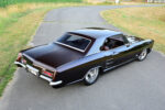 05 1963 Buick Riviera rolling shot with black paint custom interior and lowered stance