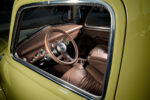 07 1952 Chevrolet 3100 interior view highlighting a custom brown leather wrapped steering wheel and classic instrument panel