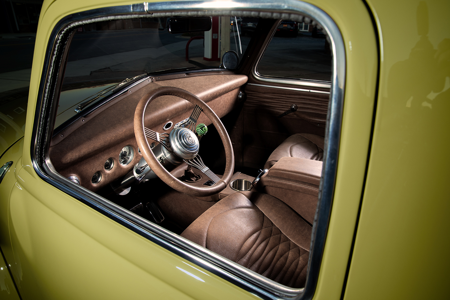 07 1952 Chevrolet 3100 interior view highlighting a custom brown leather wrapped steering wheel and classic instrument panel