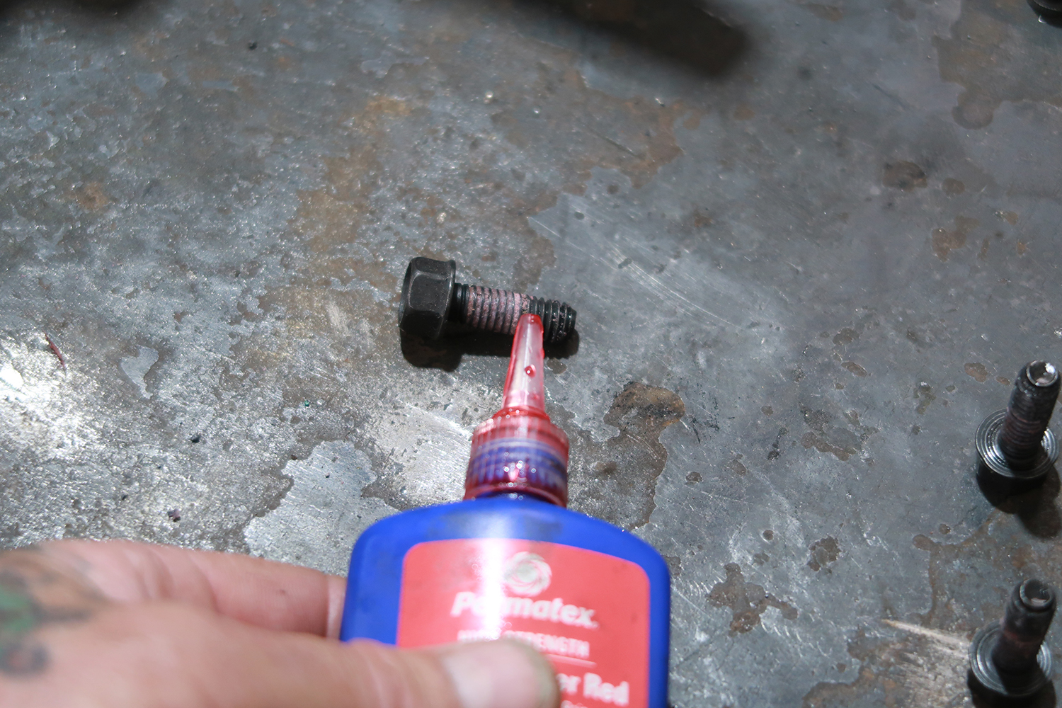 08 Thread locker applied to bolts for secure clutch mounting