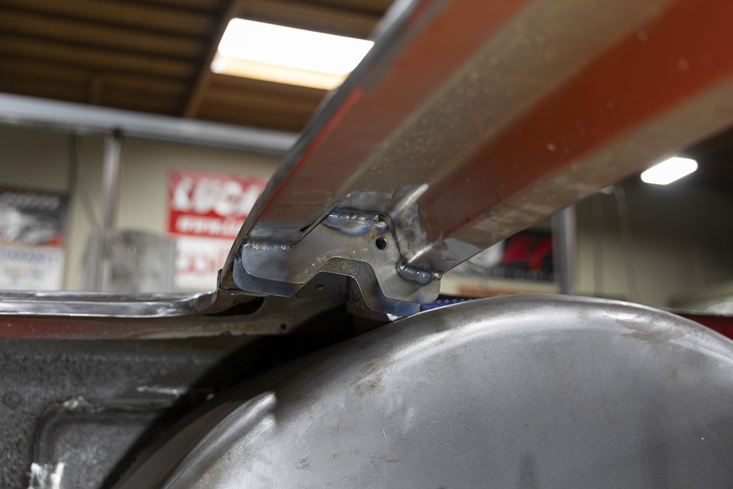 09 Final welded hood hinge bracket on a 1962 Chevy Impala