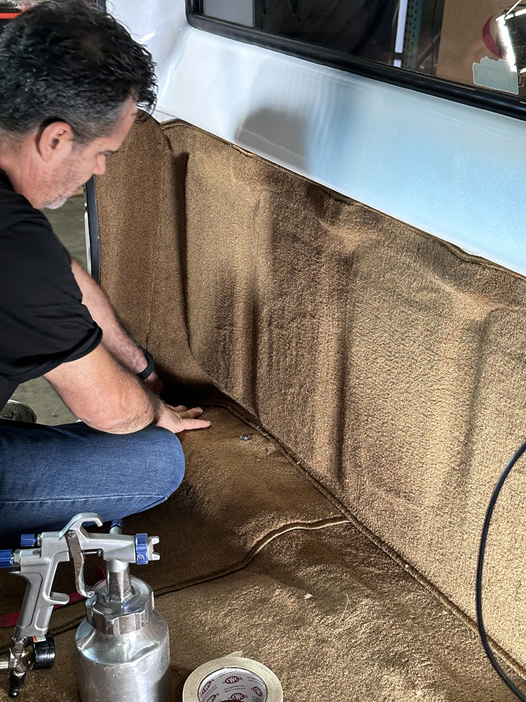 09 Spray gun and tape ready for securing carpet in truck’s rear section