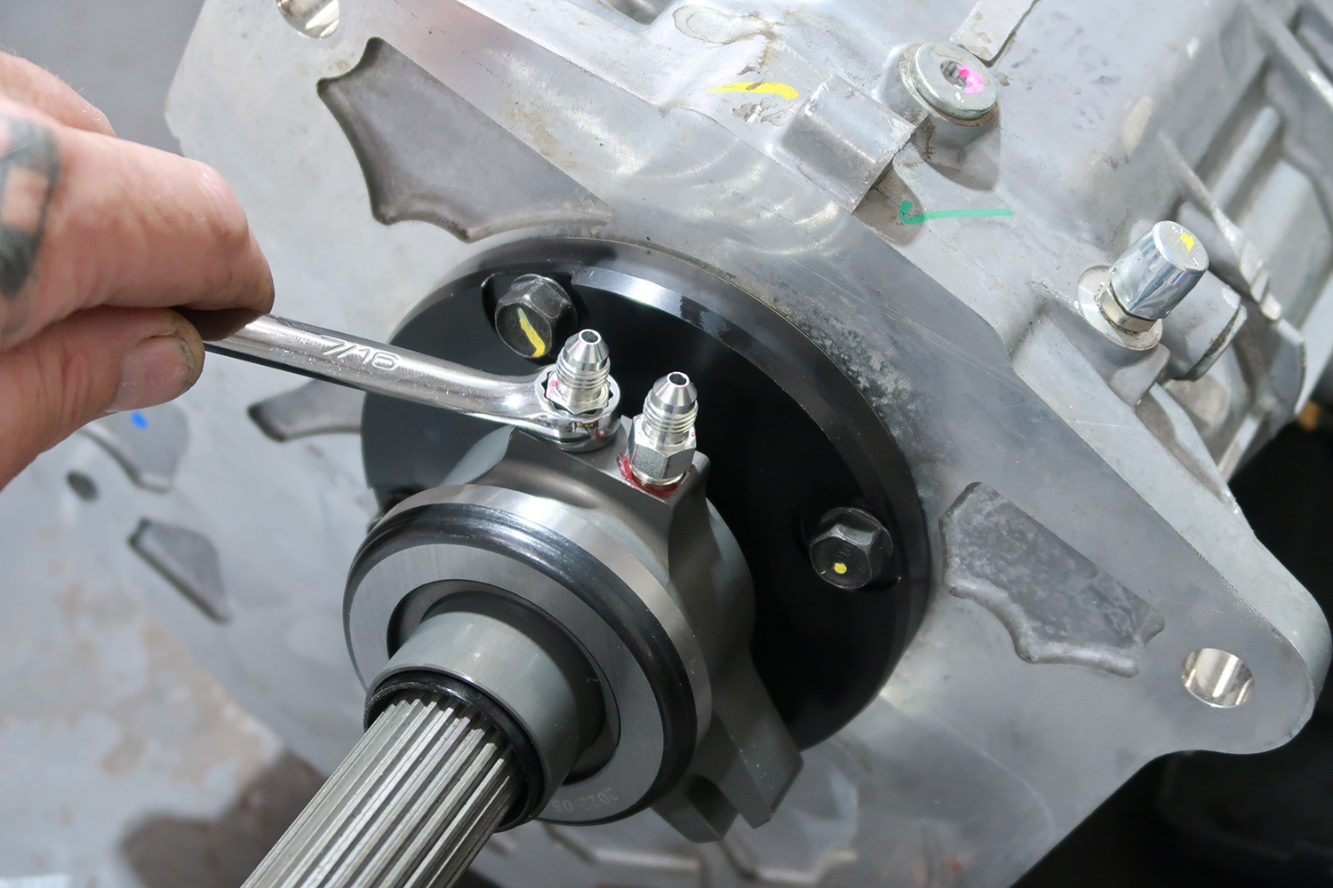 09 Technician tightens hydraulic fittings for leak free operation