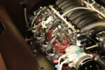 10 1963 Buick Riviera detailed LS engine view with ignition upgrades fuel rails and cooling components