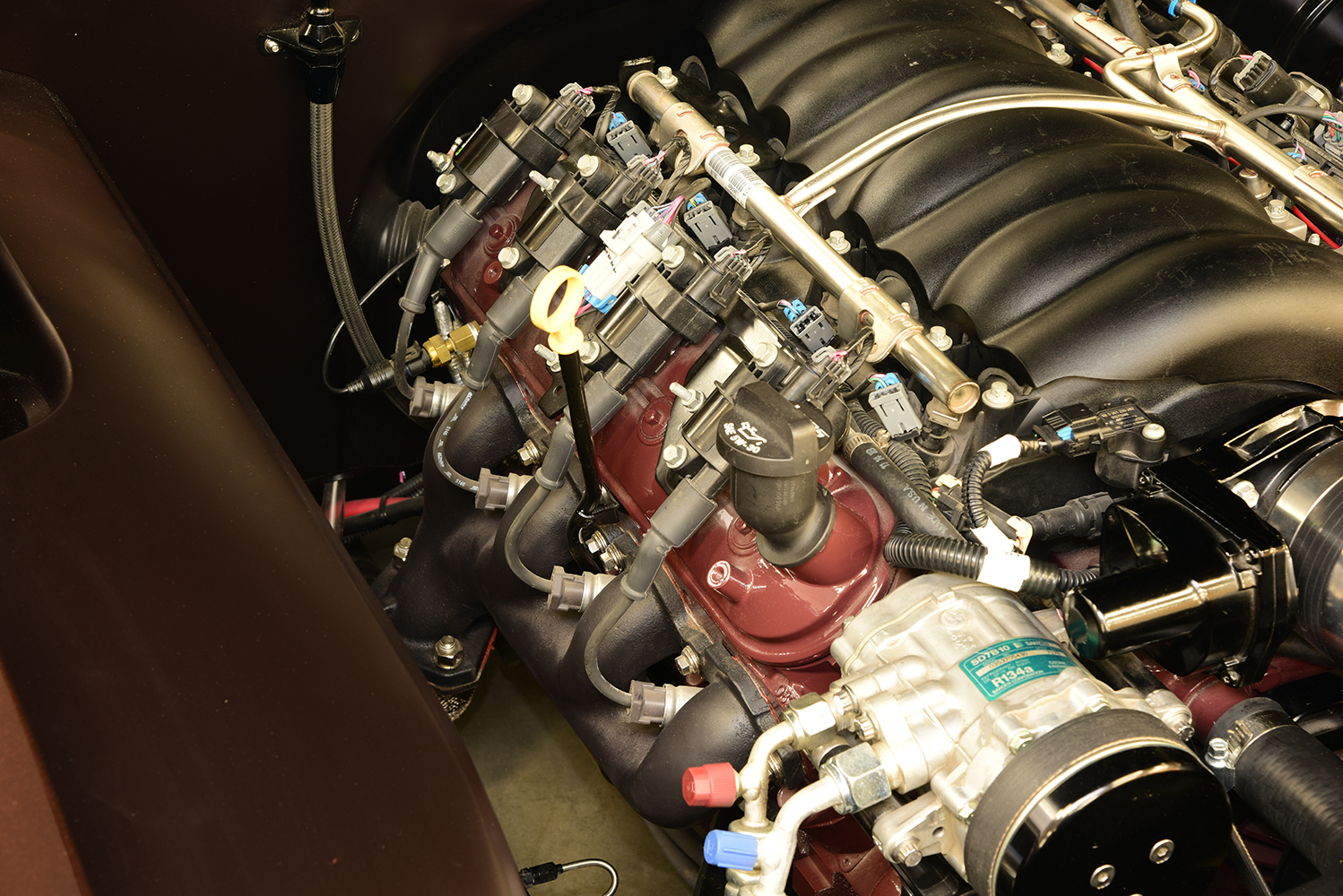10 1963 Buick Riviera detailed LS engine view with ignition upgrades fuel rails and cooling components