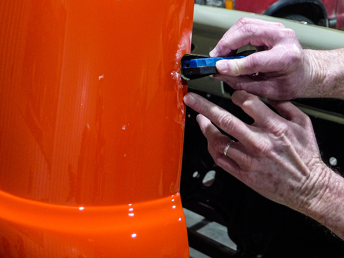 10 Scraping off excess paint buildup with a precision tool