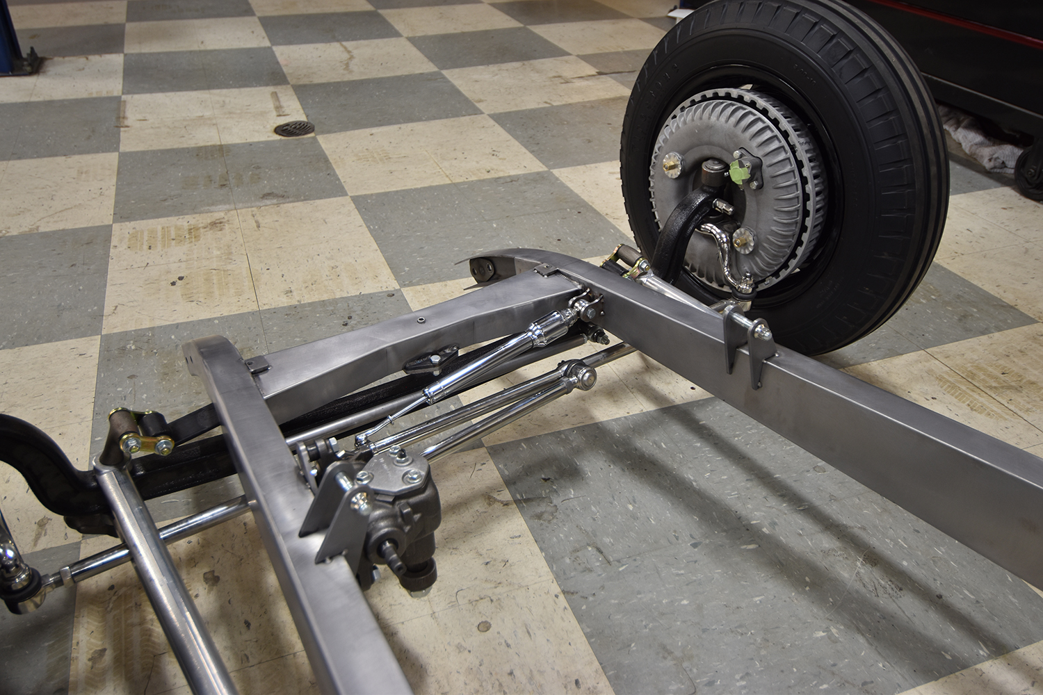 10 Steering linkage and drum brake assembly mounted to the boxed frame of the 1932 Ford Roadster chassis