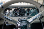 11 1960 Ford F 100 dashboard featuring a custom chrome gauge cluster and classic Ford steering wheel