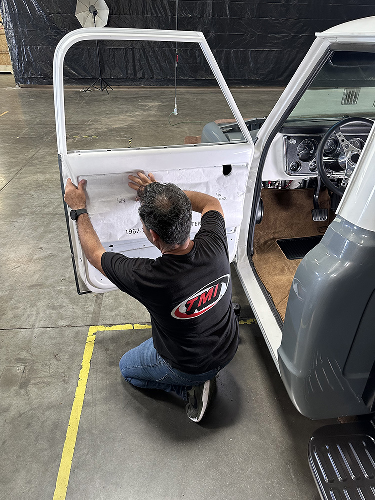 11 Template being aligned on truck door to mark installation points
