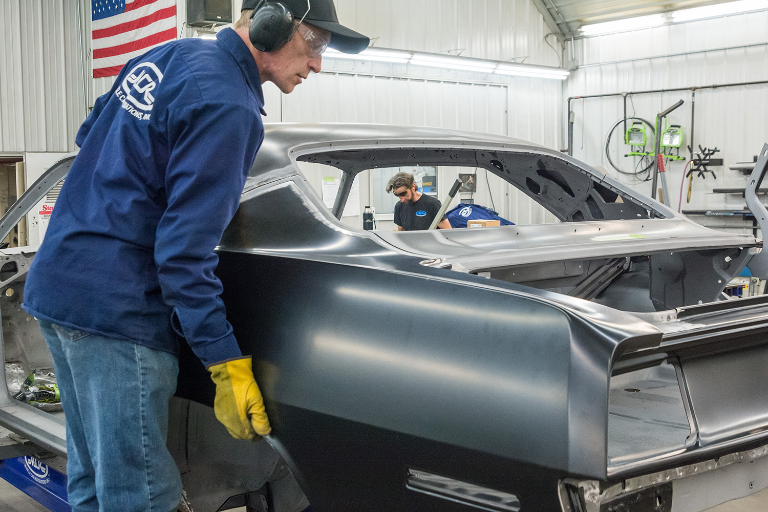 11 The new quarter panel being test fitted onto the classic car’s body before final installation
