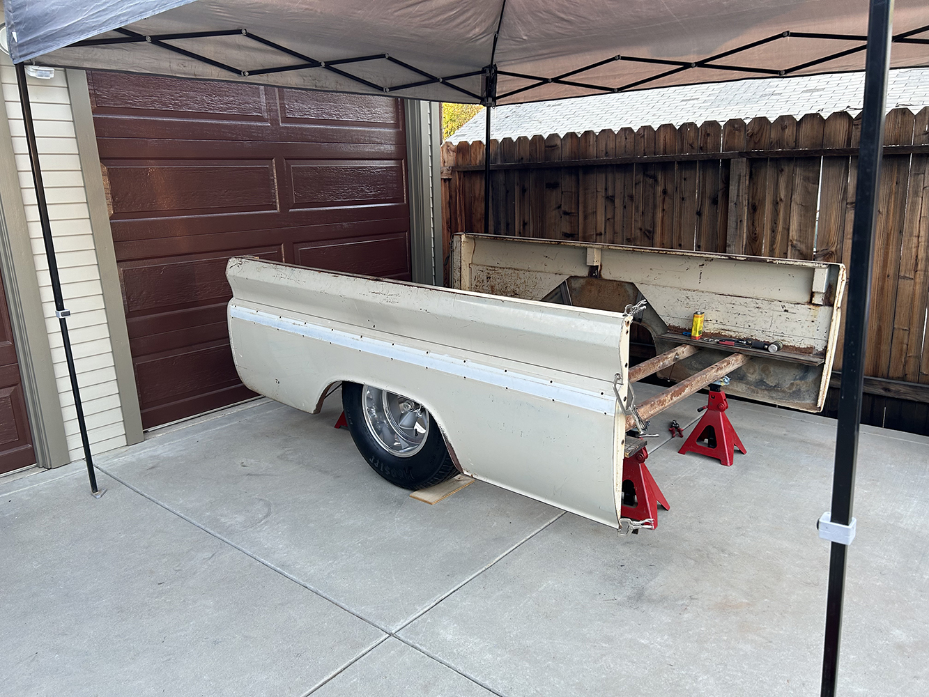 11 The truck bed disassembled and set on jack stands for restoration