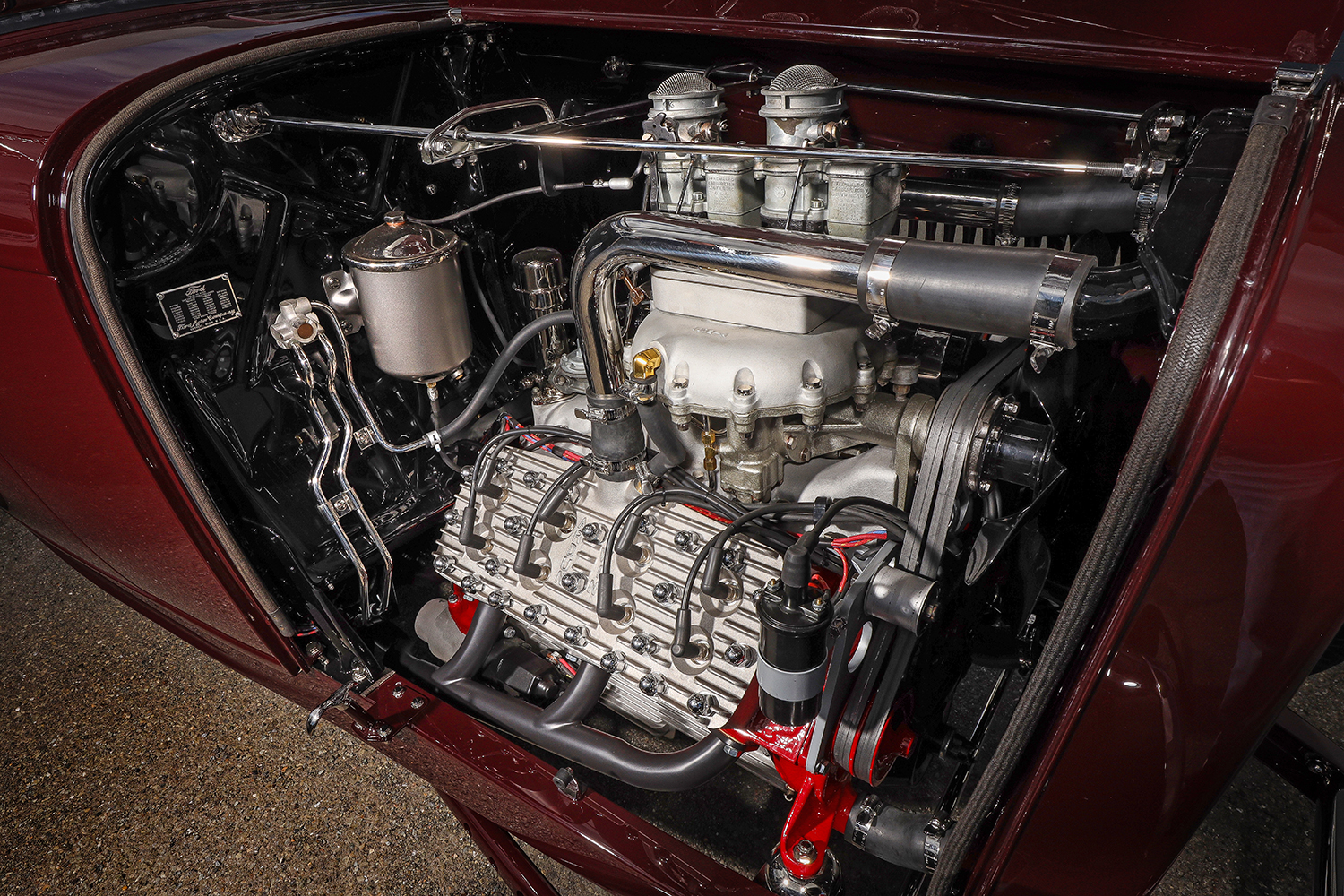 12 1932 Ford Roadster engine bay featuring a high performance Ardun OHV converted Flathead V8 with dual carburetors and polished components