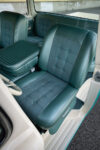 12 1960 Ford F 100 interior with custom teal leather seats and a retro styled center console
