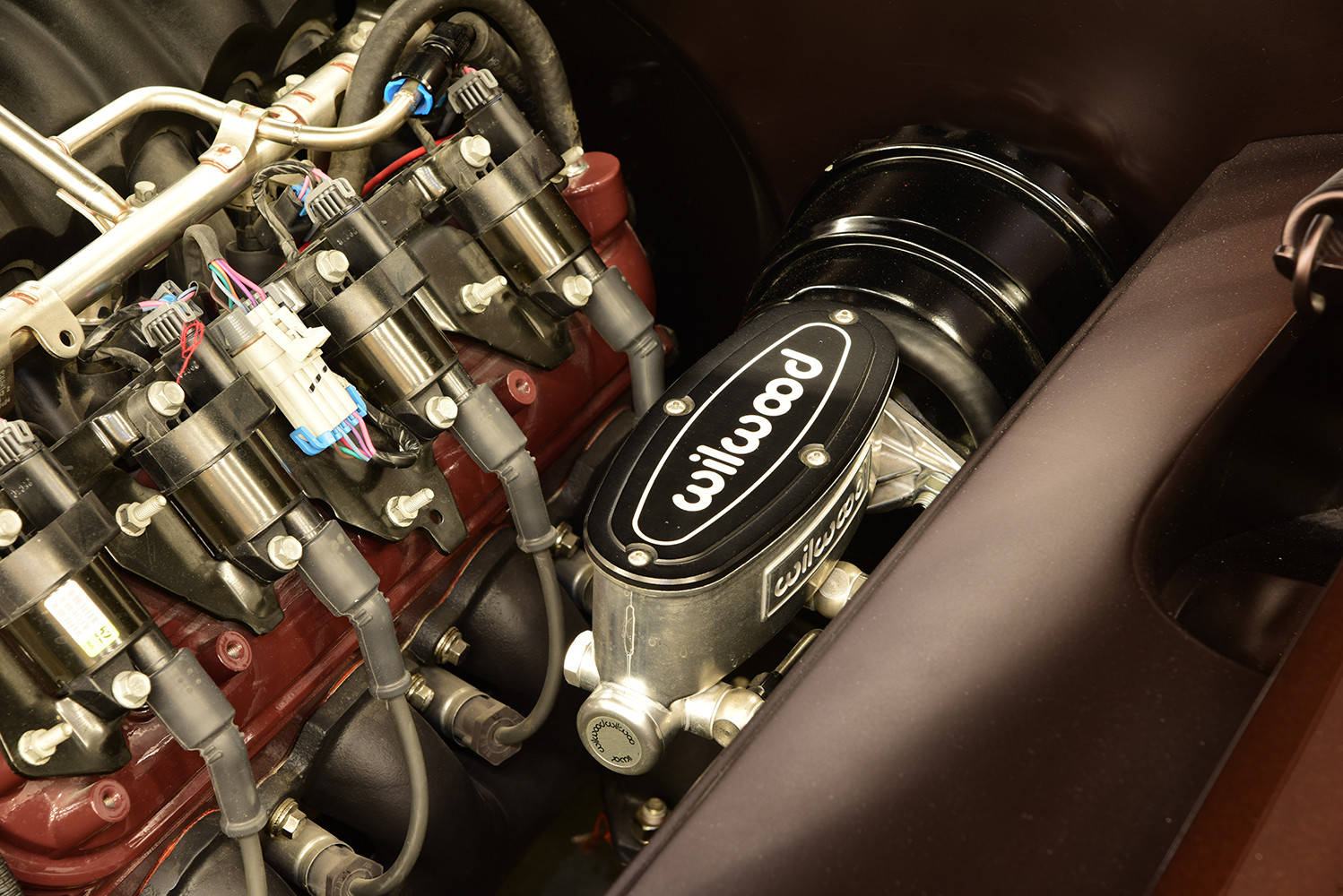12 1963 Buick Riviera close up of Wilwood master cylinder and ignition coil packs on the LS engine