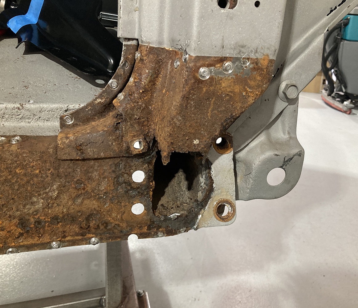 12 Drilled out spot welds preparing for removal of rusted out metal
