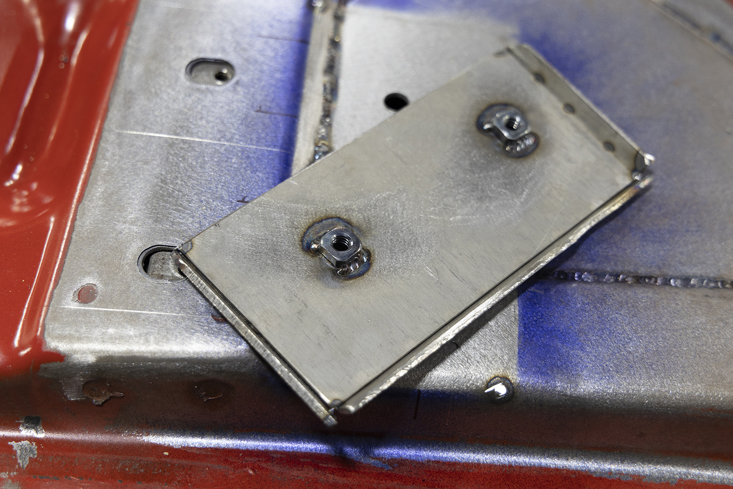 12 Fabricated mounting plate with welded nut inserts for a 1962 Chevy Impala