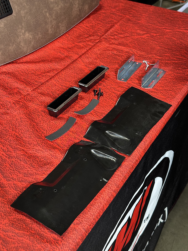 12 Hardware and trim pieces laid out for door panel assembly