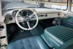 13 1960 Ford F 100 cabin showcasing a vintage inspired steering wheel and pristine dashboard layout
