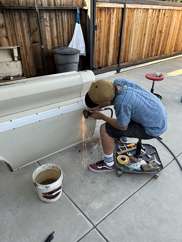 13 Grinding work in progress on the lower bedside panel to remove rust
