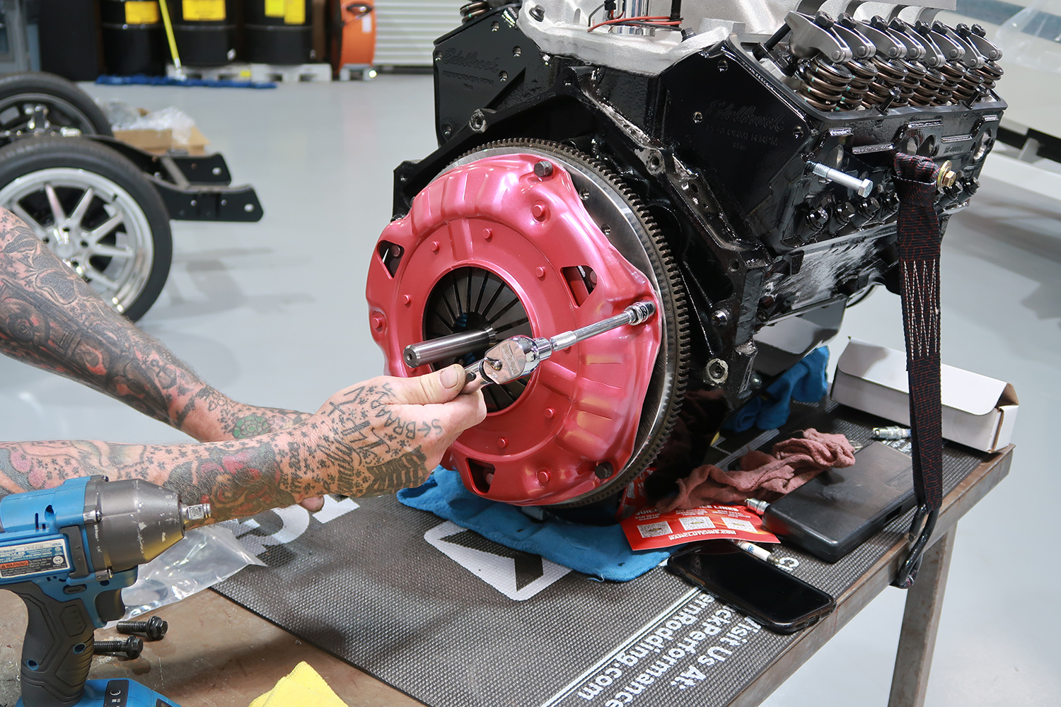 13 Pressure plate torqued down over clutch disc for secure engagement