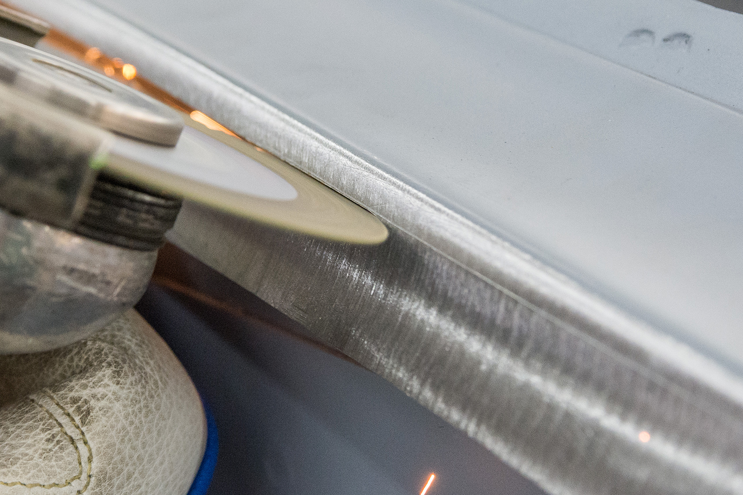 13 grinding disc smoothing the weld seam along the quarter panel joint for a clean finish