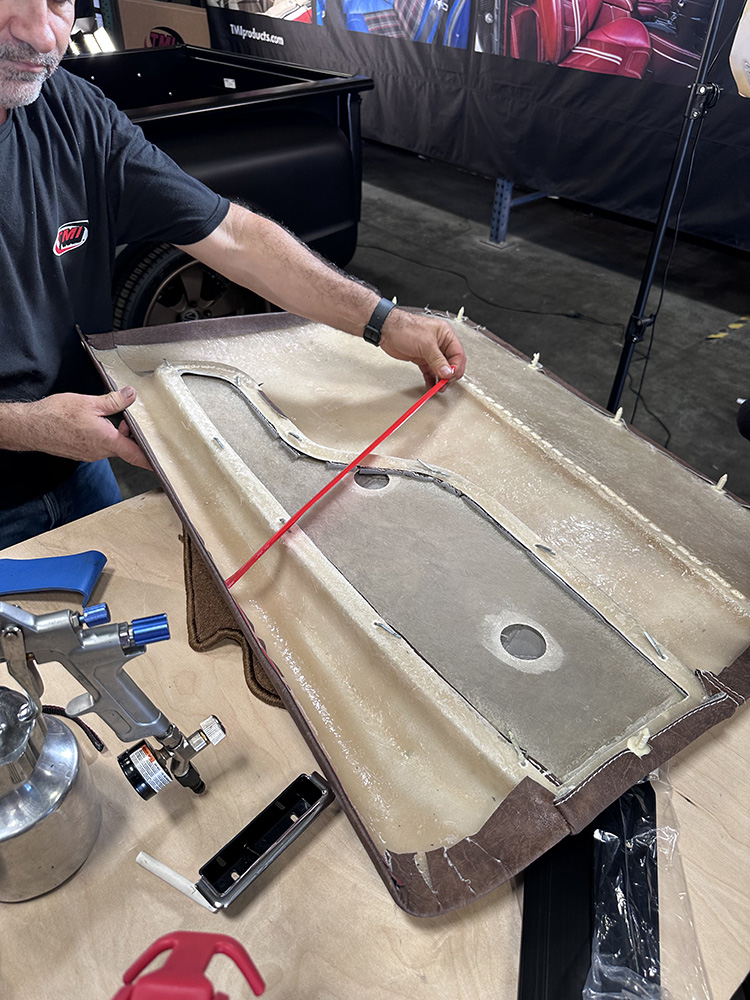 14 Adhesive backing being removed from door panel for secure fitment