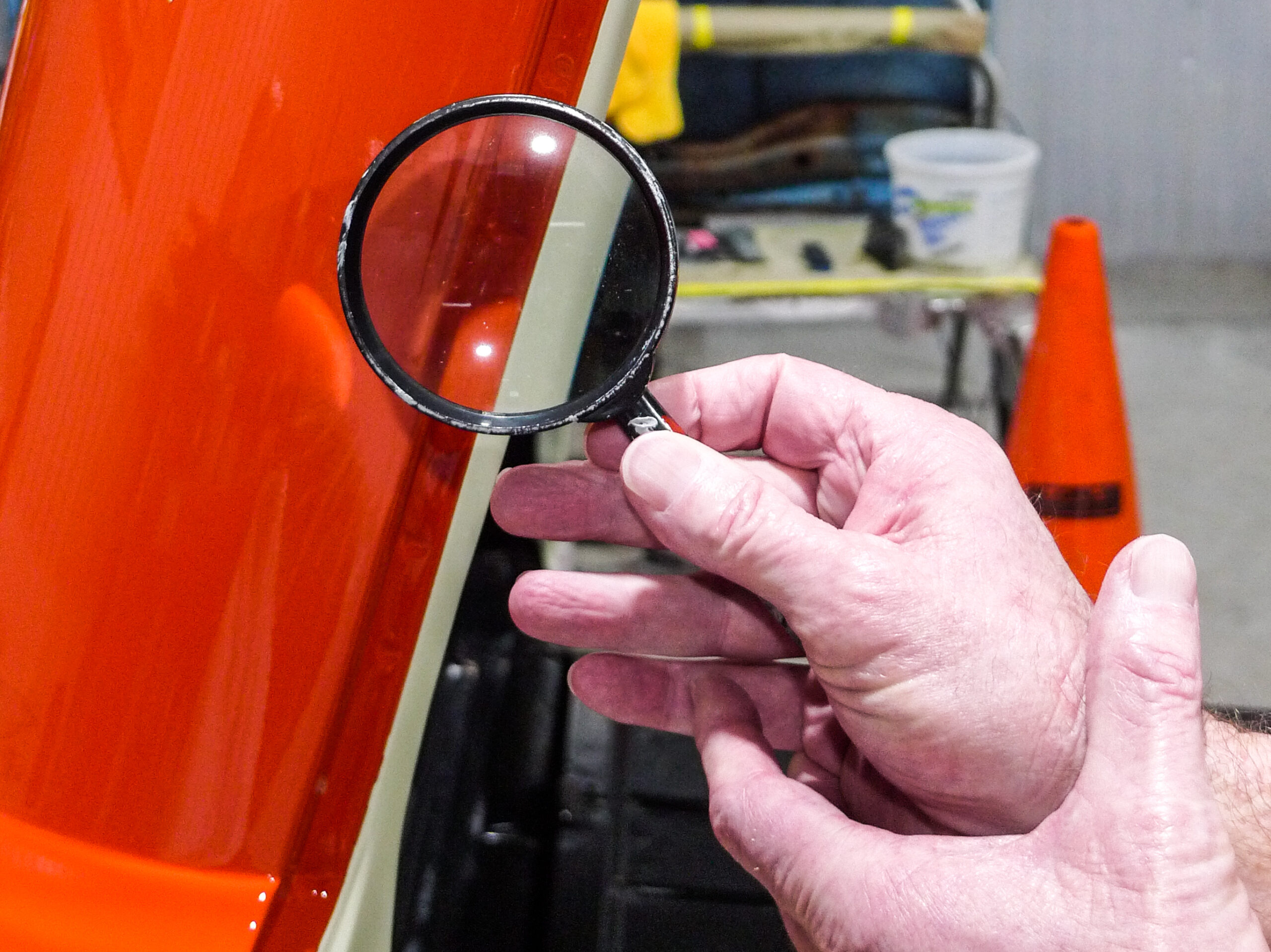 14 Inspecting the paintwork closely with a magnifying glass