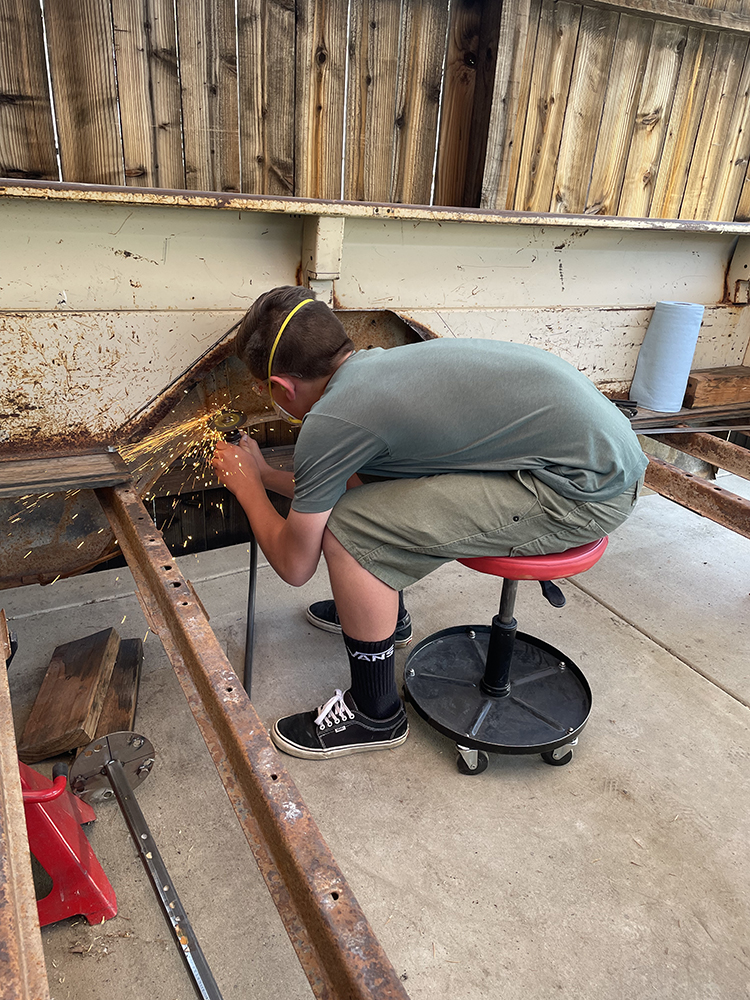 15 Drilling out old rivets from the bed floor frame in preparation for repairs