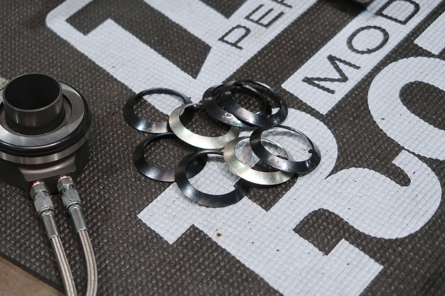 15 Shim spacers adjust throwout bearing clearance for optimal function