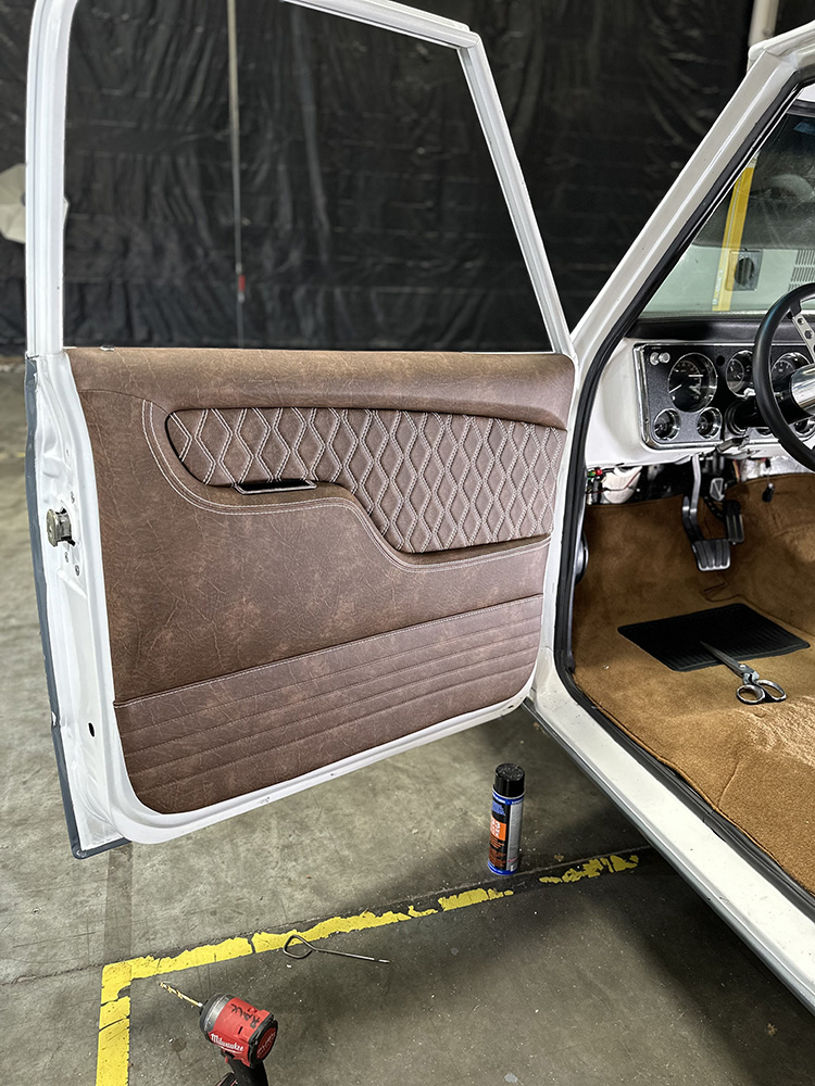 16 Fully installed TMI door panel complementing brown carpet interior