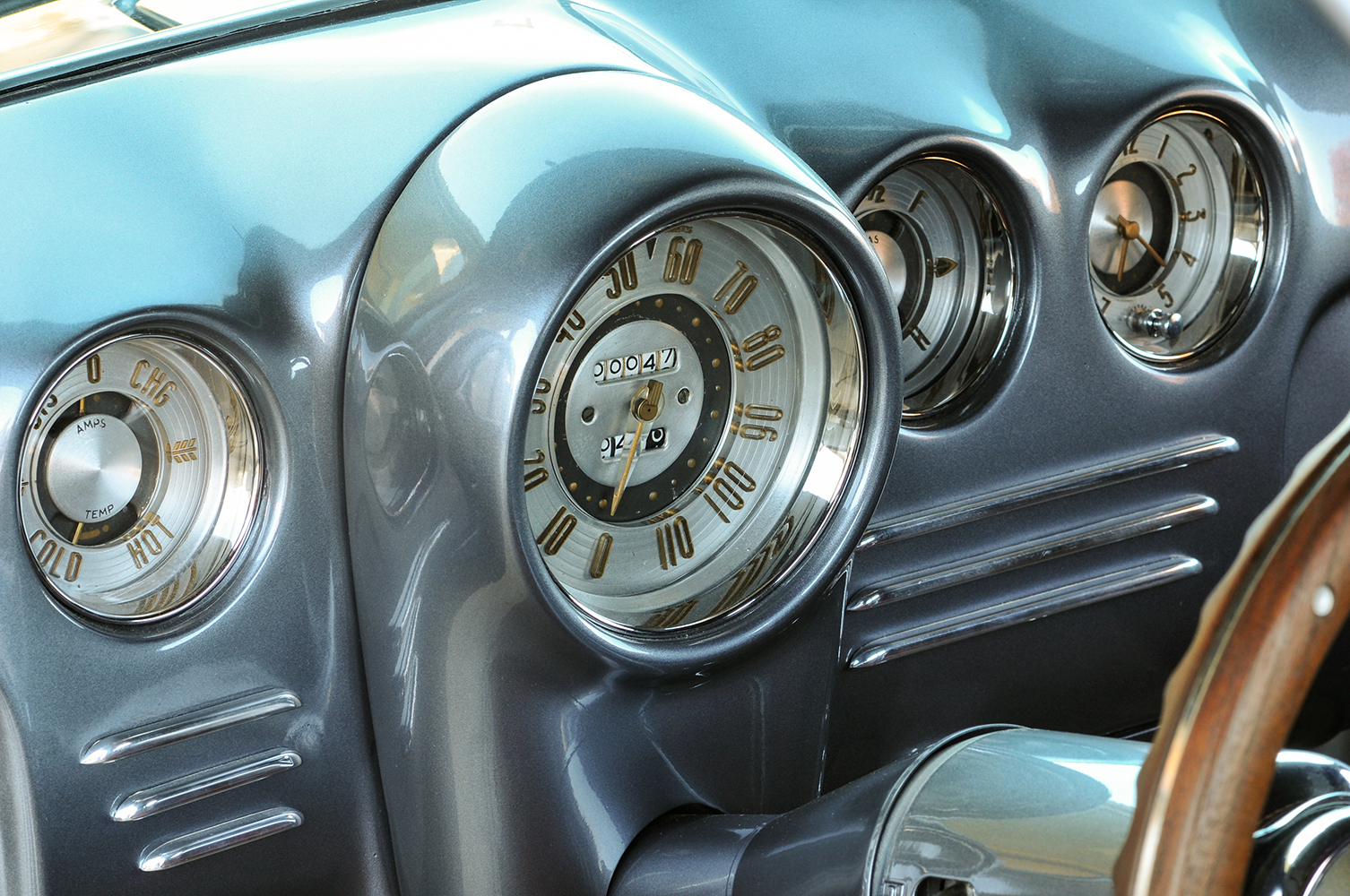 17 1935 Chevy Coupe close up dash shot vintage gauges gold numbering retro design
