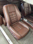 17 1963 Buick Riviera front bucket seats with plush brown leather upholstery and custom stitching