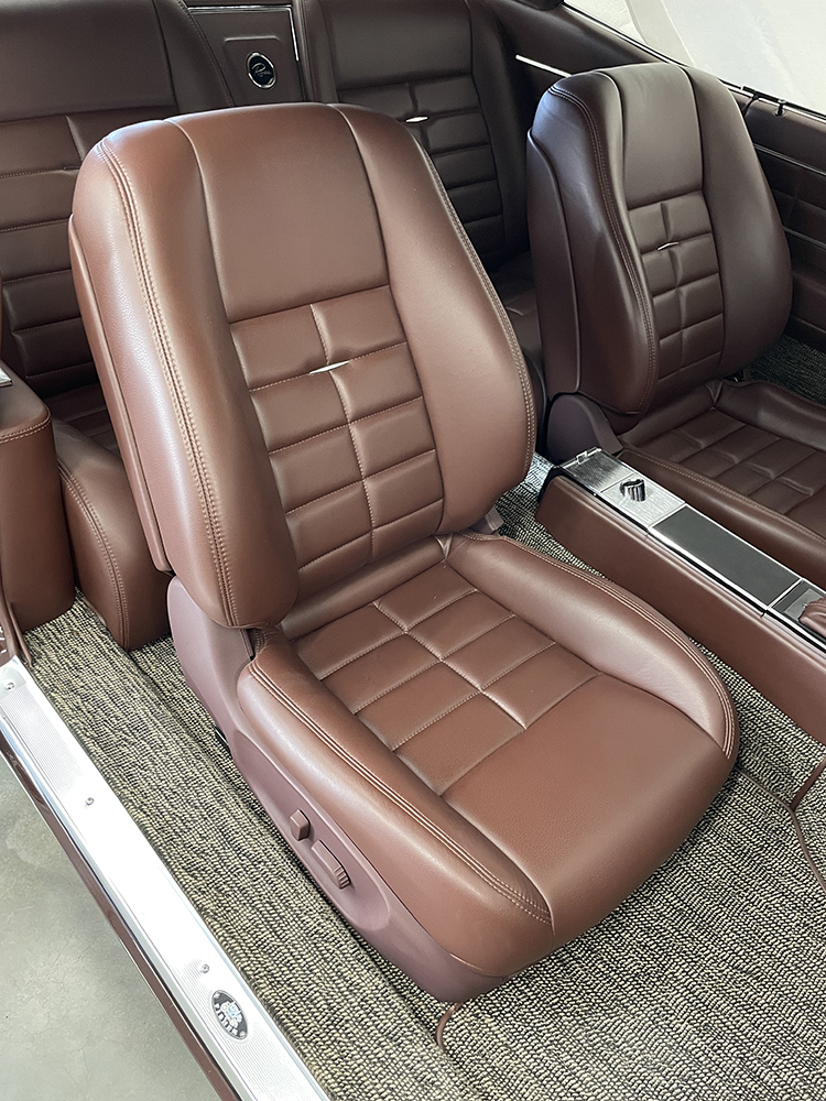 17 1963 Buick Riviera front bucket seats with plush brown leather upholstery and custom stitching