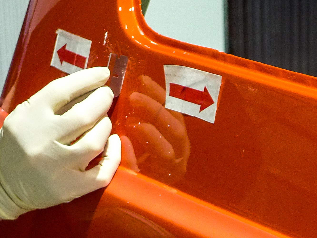 17 Carefully scraping paint runs to level the surface