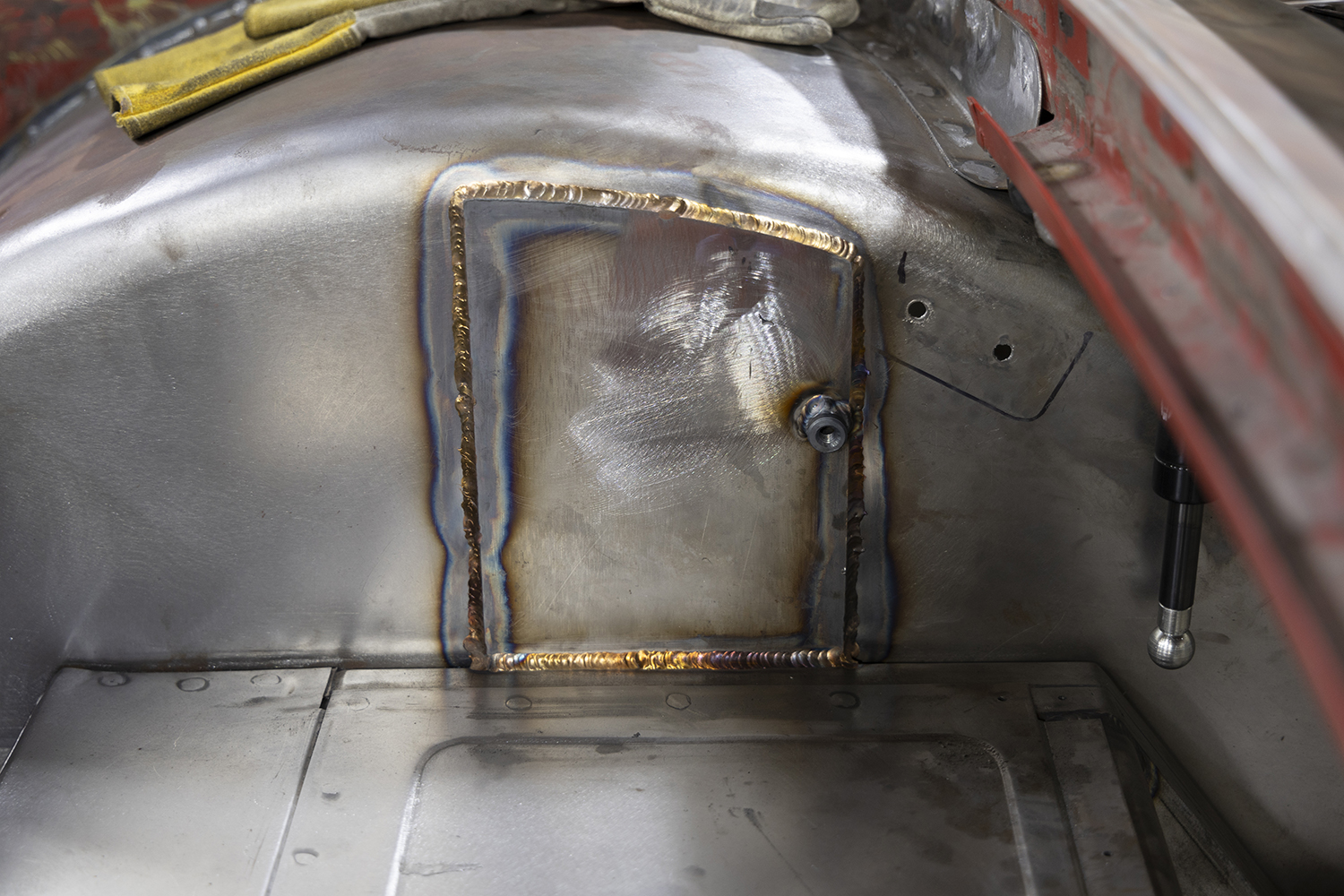17 Custom fabricated access panel welded onto a 1962 Chevy Impala wheel tub