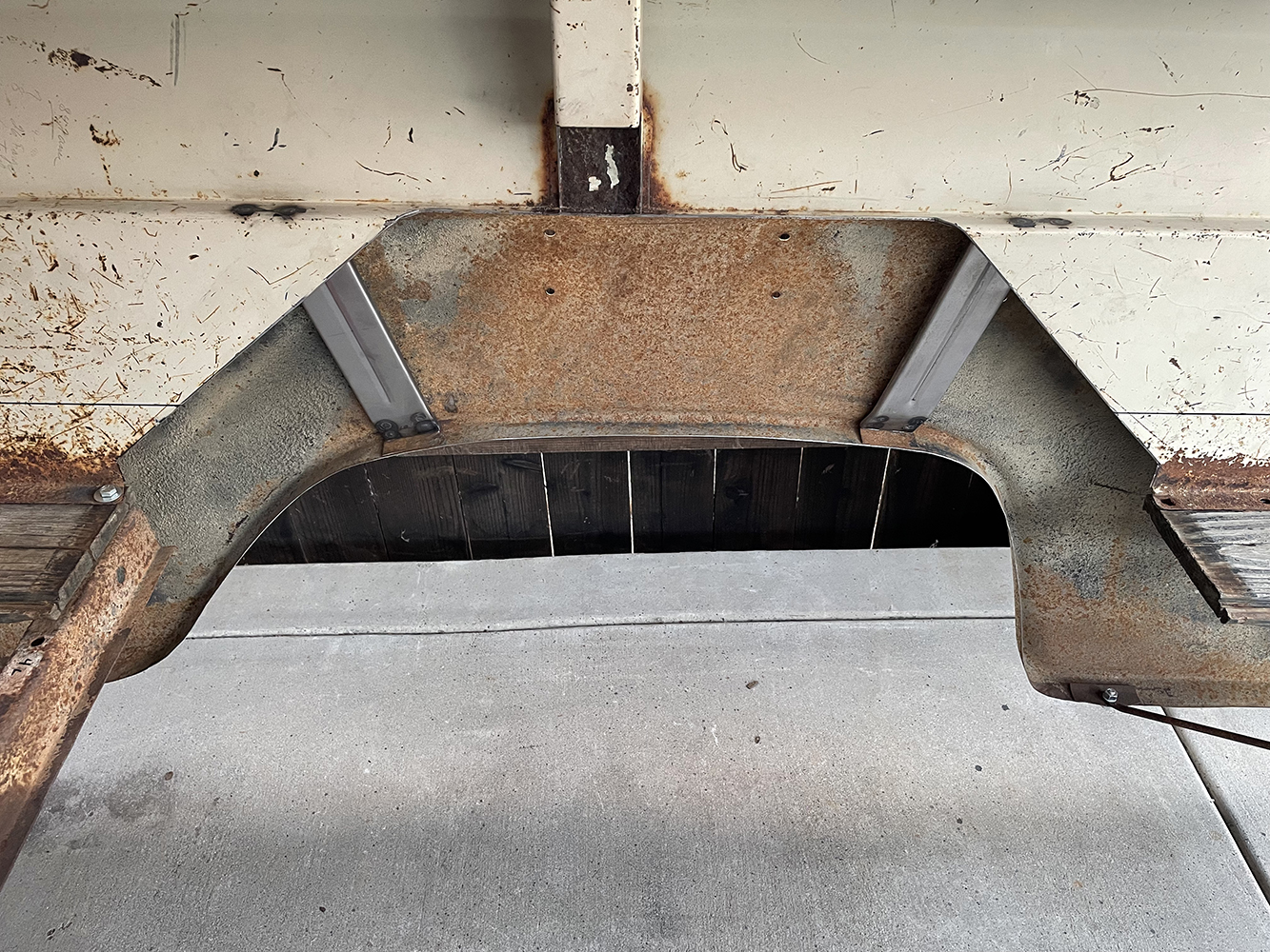 17 Custom wheel tub cutout in the truck bed with reinforcement plates installed
