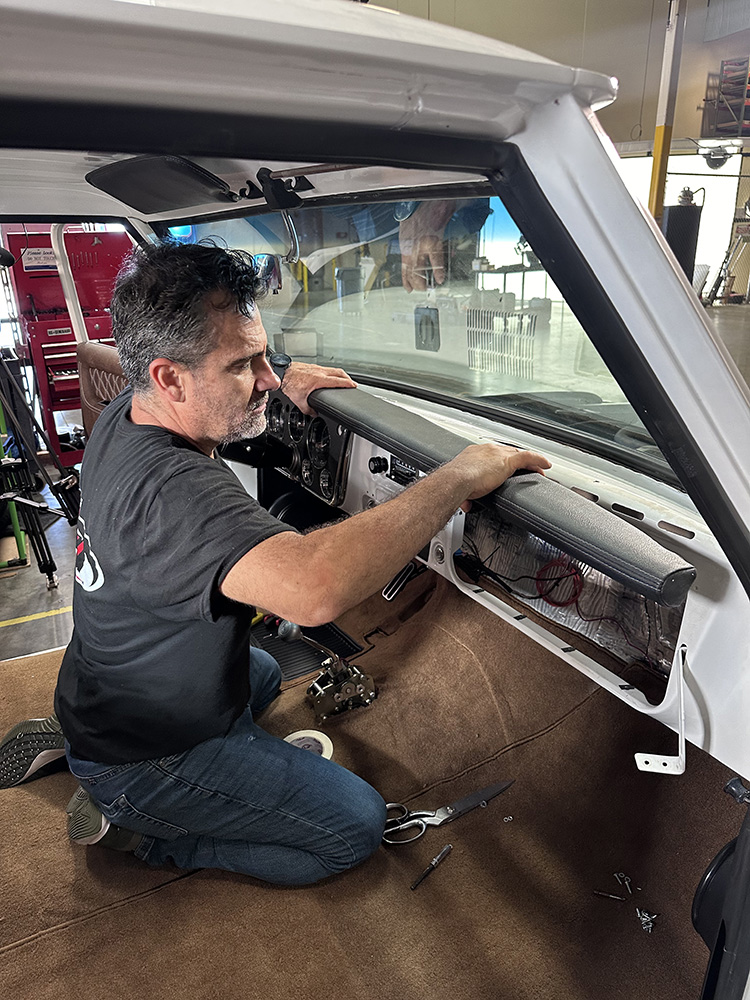 17 Dashboard being secured in place with leather wrapped trim