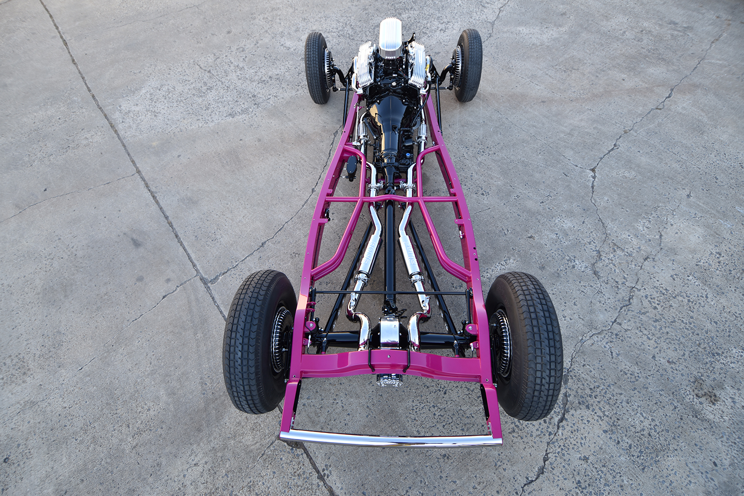 18 1932 Ford chassis with pink frame and polished V8