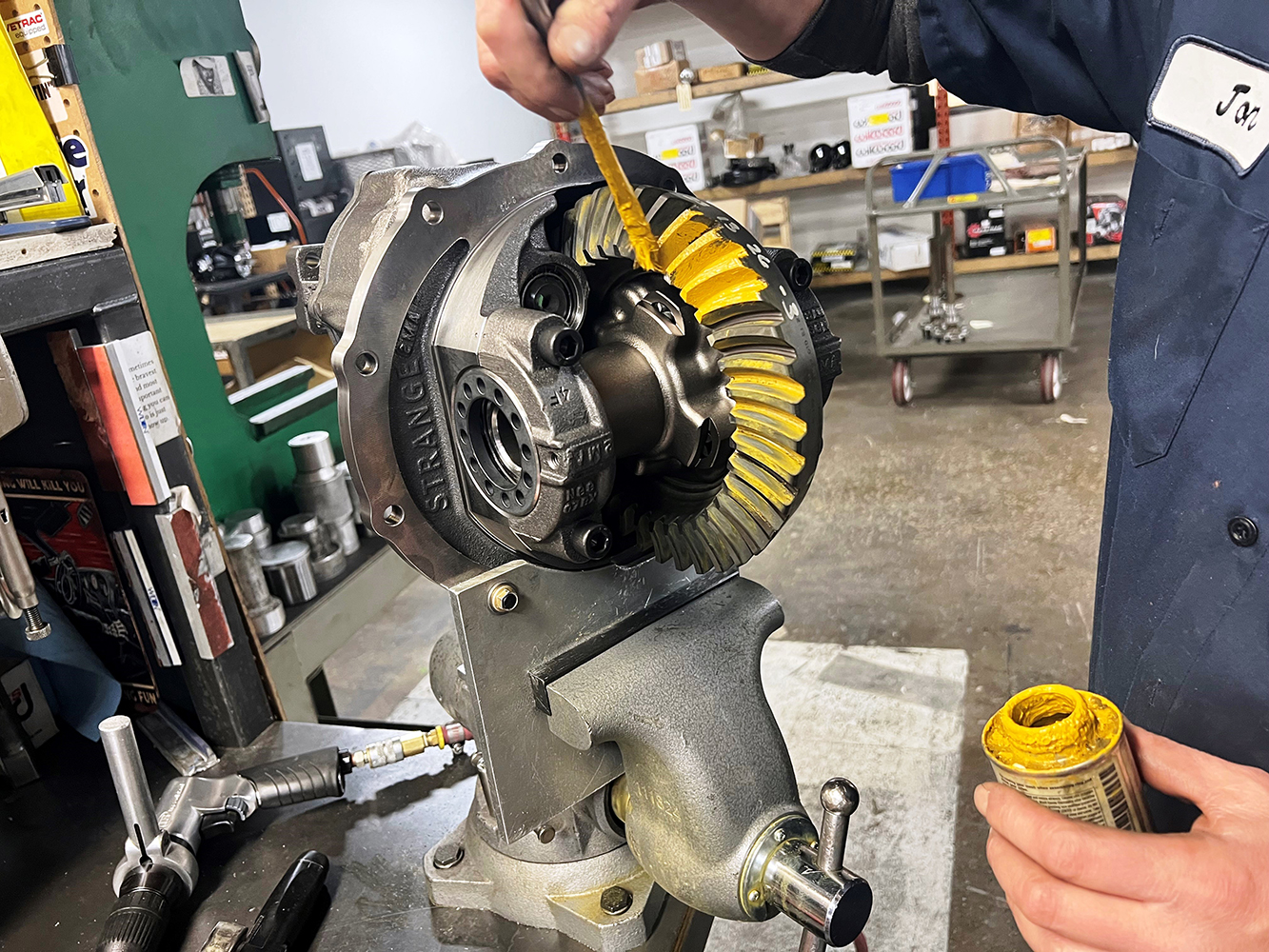 20 Applying gear marking compound to check proper contact pattern on the ring and pinion gears
