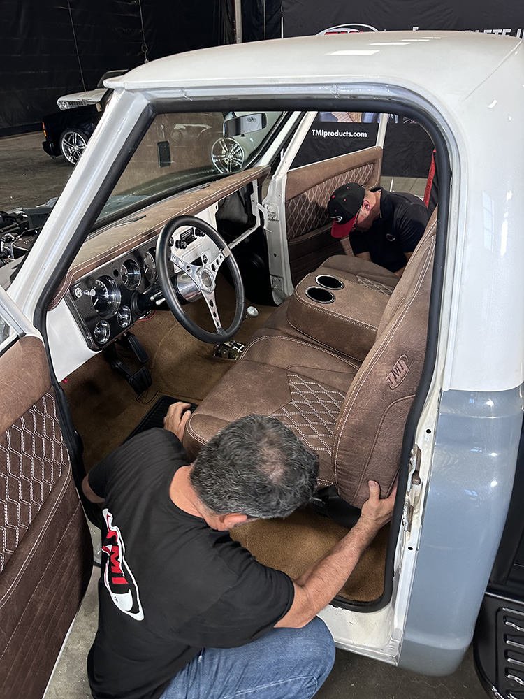 20 TMI bench seat being installed with diamond stitched upholstery