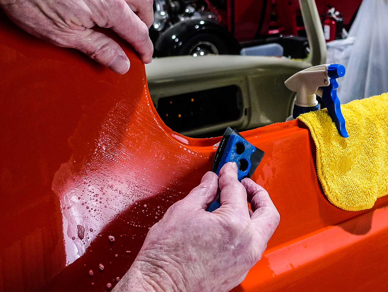 20 Wet sanding the freshly painted surface for smoothness